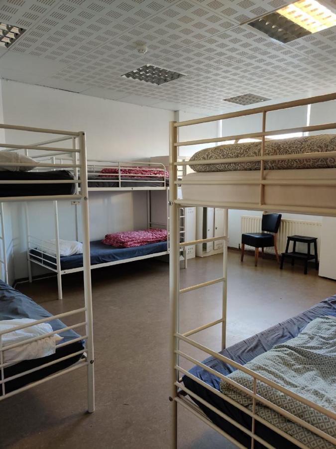 Cama en habitación compartida de 8 camas